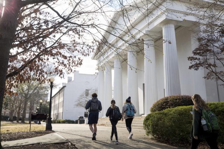 Students walking past chapel